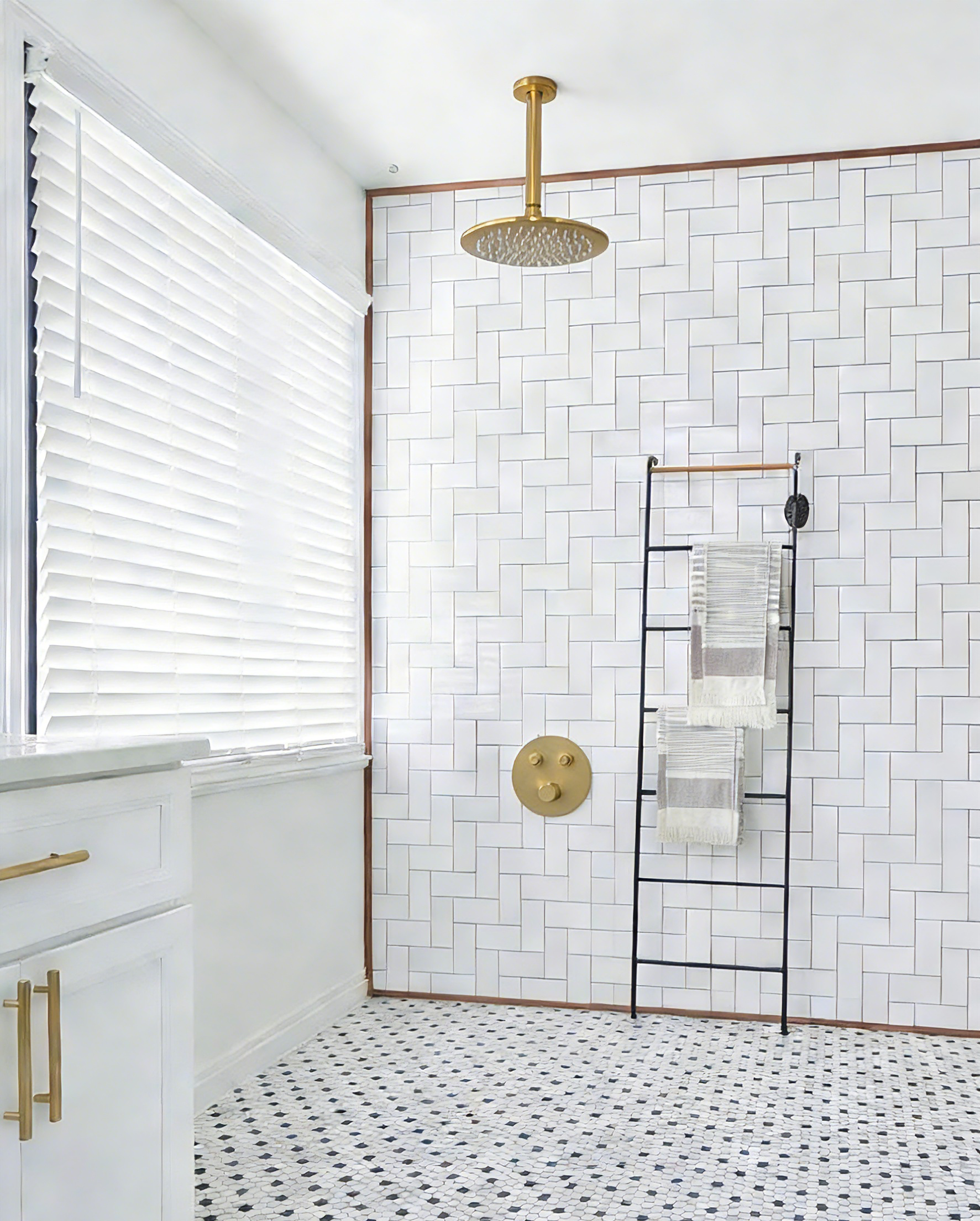 Which style pairs better with brushed gold finish plumbing parts: navy blue tiles or white tiles